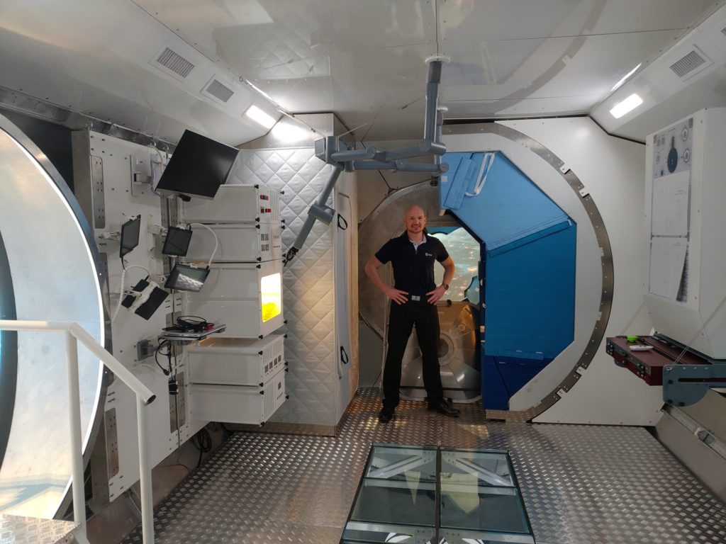 Room with astronaut and equipment