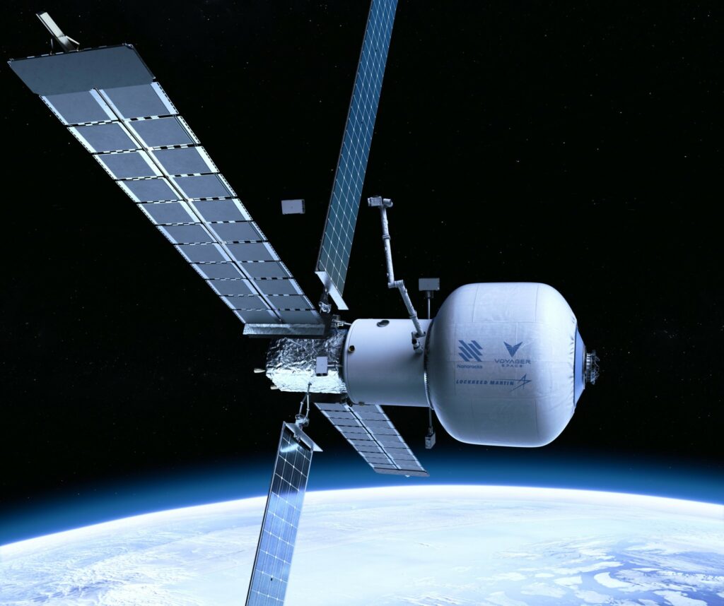 space station with solar arrays and inflatable module